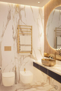 Luxurious bathroom with marble walls and brass accents